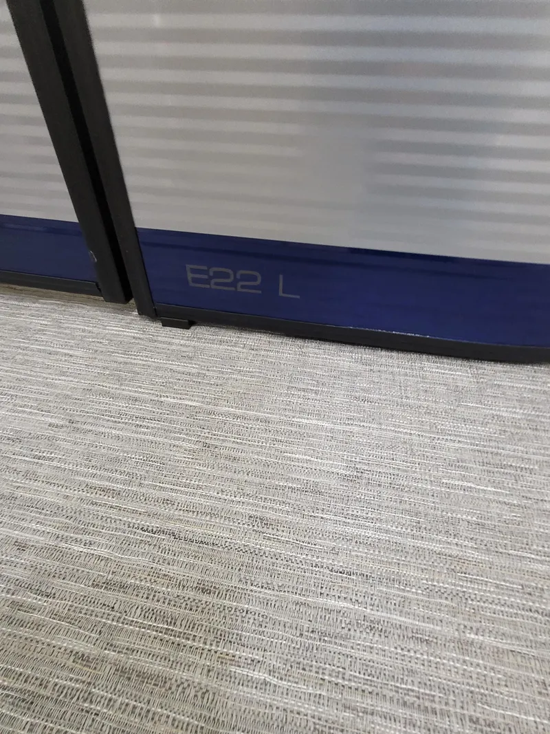 Slide: The Image of 2025 Quest 22 LE interior detail with carpeted flooring and paneling. - 21