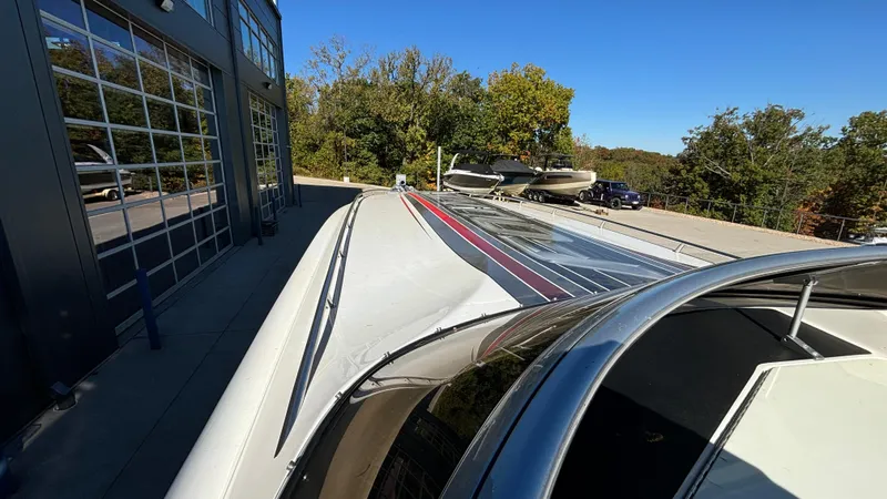 Slide: The Image of 2008 Fountain 47 Lightning boat parked outside, showcasing sleek design and vibrant colors. - 11