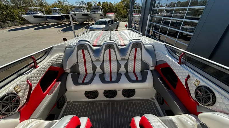 Slide: The Image of Interior of a 2008 Fountain 47 Lightning boat with red and gray seating. - 18