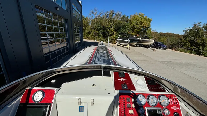 Slide: The Image of Cockpit view of 2008 Fountain 47 Lightning boat with dashboard and outdoor setting. - 25