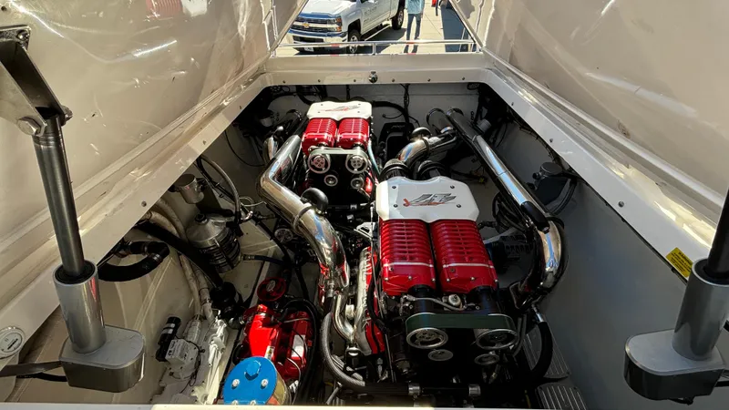 Slide: The Image of Engine compartment of a 2008 Fountain 47 Lightning boat, showcasing powerful dual engines. - 26