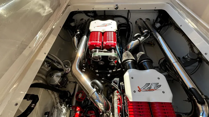 Slide: The Image of Engine compartment of a 2008 Fountain 47 Lightning boat, showcasing powerful twin engines. - 28