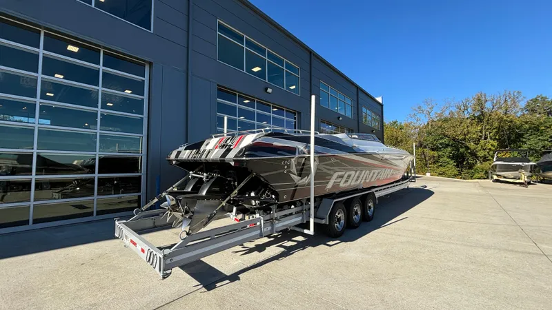 Slide: The Image of 2008 Fountain 47 Lightning boat on trailer outside a modern building. - 3