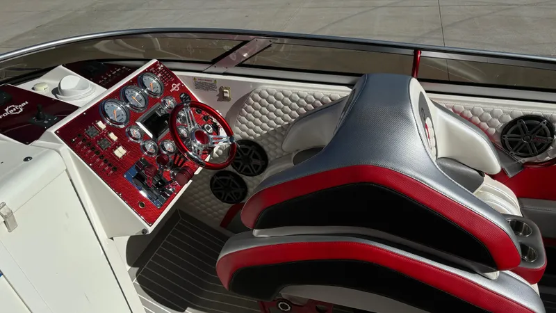 Slide: The Image of Interior of 2008 Fountain 47 Lightning boat with red and black dashboard and seating. - 34