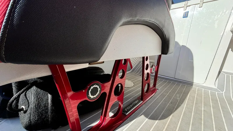 Slide: The Image of 2008 Fountain 47 Lightning boat interior with red metal seat support and striped flooring. - 37