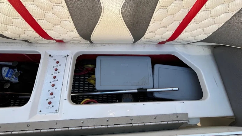 Slide: The Image of Interior view of a 2008 Fountain 47 Lightning boat showing storage compartments and seating. - 39