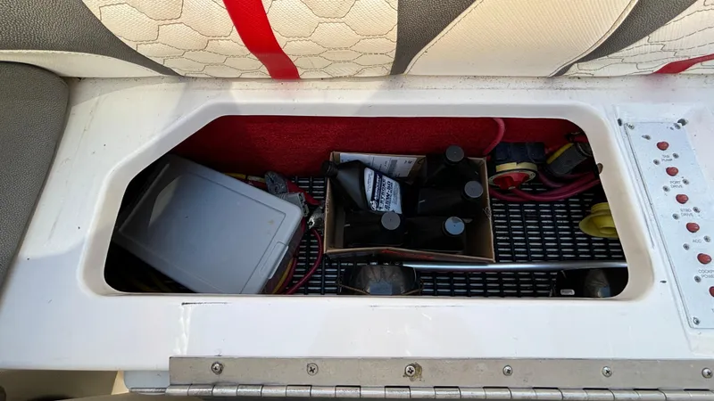 Slide: The Image of Storage compartment in a 2008 Fountain 47 Lightning boat with various items. - 40