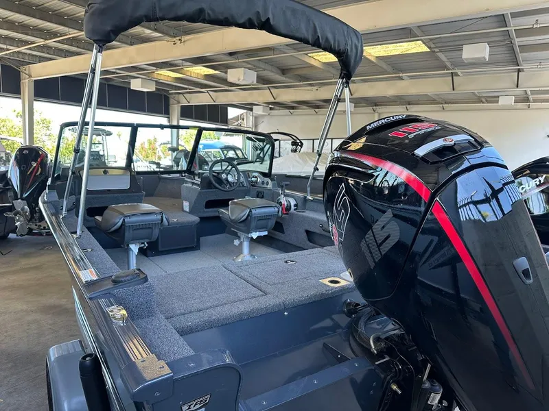Slide: The Image of 2025 Lund 1775 Adventure Sport boat with Mercury engine in showroom. - 4
