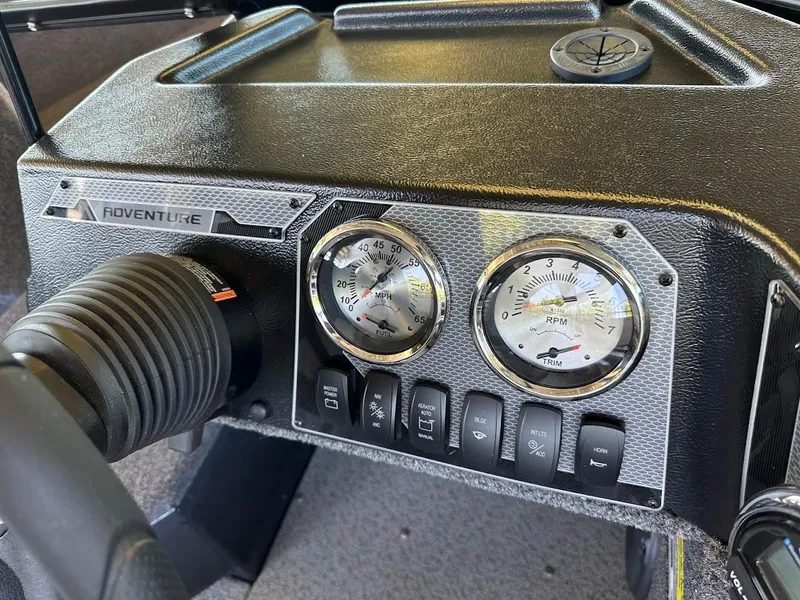 Slide: The Image of Dashboard of 2025 Lund 1775 Adventure Sport boat with gauges and controls. - 9