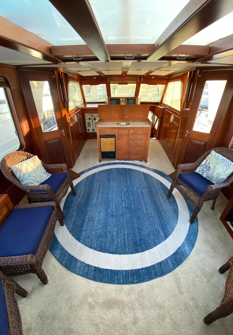 Slide: The Image of Interior of 1971 Matthews Custom Pilothouse Motor Yacht with elegant seating and nautical decor. - 14