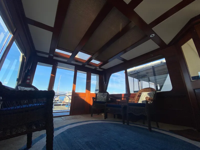 Slide: The Image of Interior of 1971 Matthews Custom Pilothouse Motor Yacht with elegant wood finish and seating. - 15