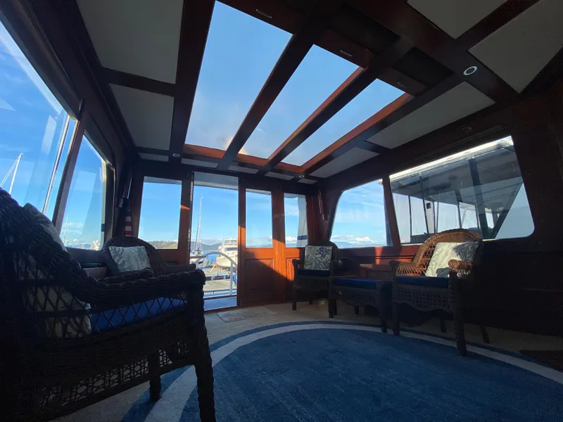 Slide: The Image of Interior of 1971 Matthews Custom Pilothouse Motor Yacht with panoramic windows and elegant seating. - 16
