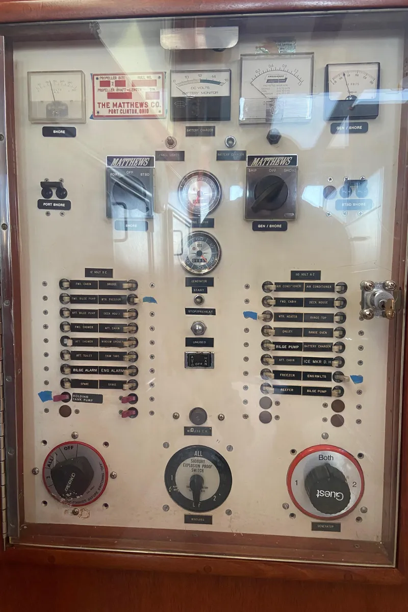Slide: The Image of Control panel of a 1971 Matthews Custom Pilothouse Motor Yacht with gauges and switches. - 19