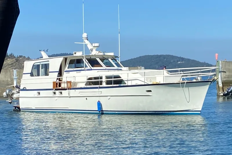 Slide: The Image of 1971 Matthews Custom Pilothouse Motor Yacht on calm water, clear sky background. - 2