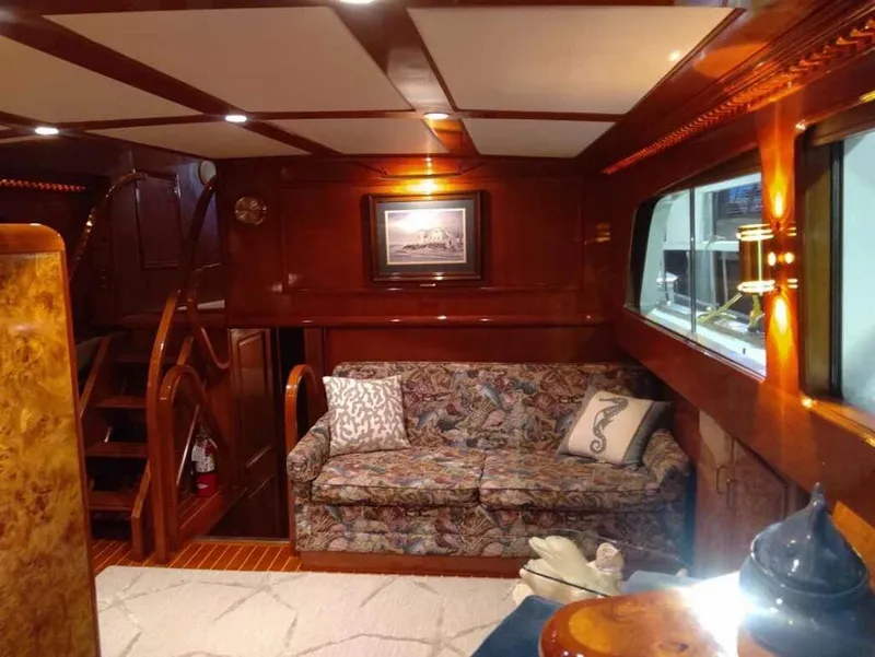Slide: The Image of Luxurious interior of a 1971 Matthews Custom Pilothouse Motor Yacht with elegant wood finishes. - 25