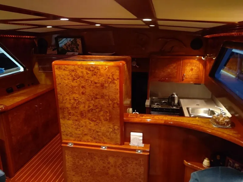 Slide: The Image of Luxurious 1971 Matthews Custom Pilothouse Motor Yacht interior with wood finish and modern amenities. - 26