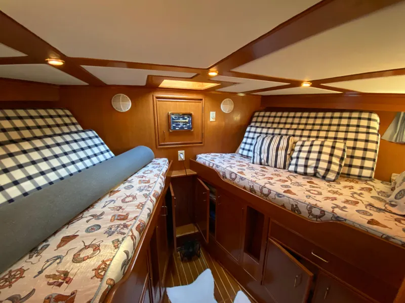 Slide: The Image of 1971 Matthews Custom Pilothouse Motor Yacht cabin with twin beds and nautical decor. - 29