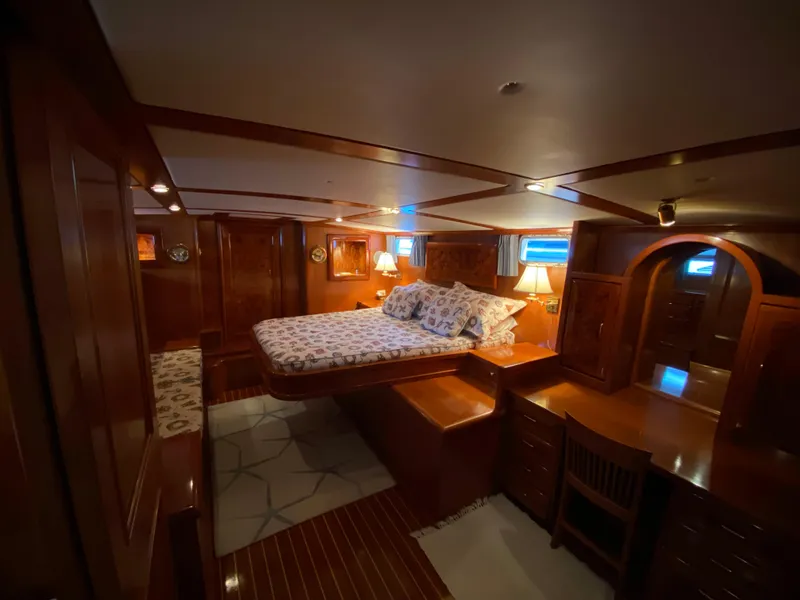 Slide: The Image of Luxurious wooden interior of a 1971 Matthews Custom Pilothouse Motor Yacht bedroom. - 31
