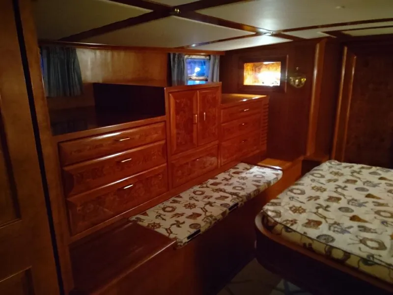 Slide: The Image of Luxurious wooden interior of a 1971 Matthews Custom Pilothouse Motor Yacht cabin. - 33