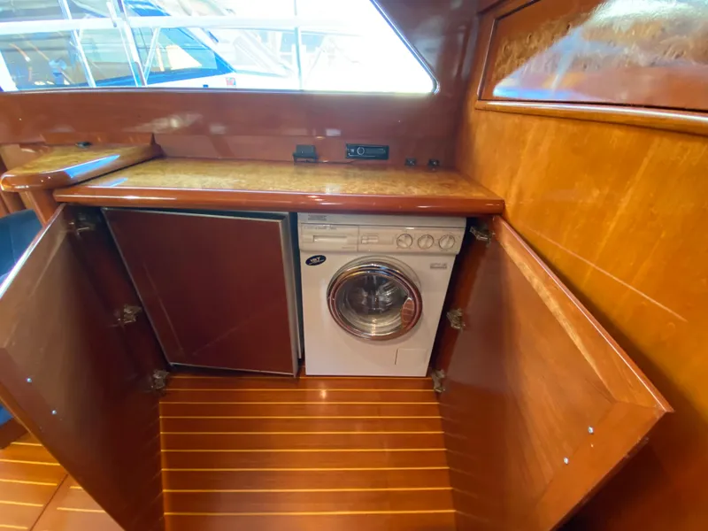 Slide: The Image of 1971 Matthews Custom Pilothouse Motor Yacht interior with built-in washing machine. - 39