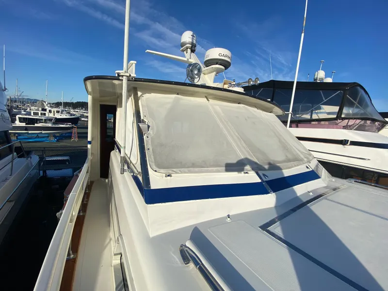 Slide: The Image of 1971 Matthews Custom Pilothouse Motor Yacht docked under clear blue sky. - 4