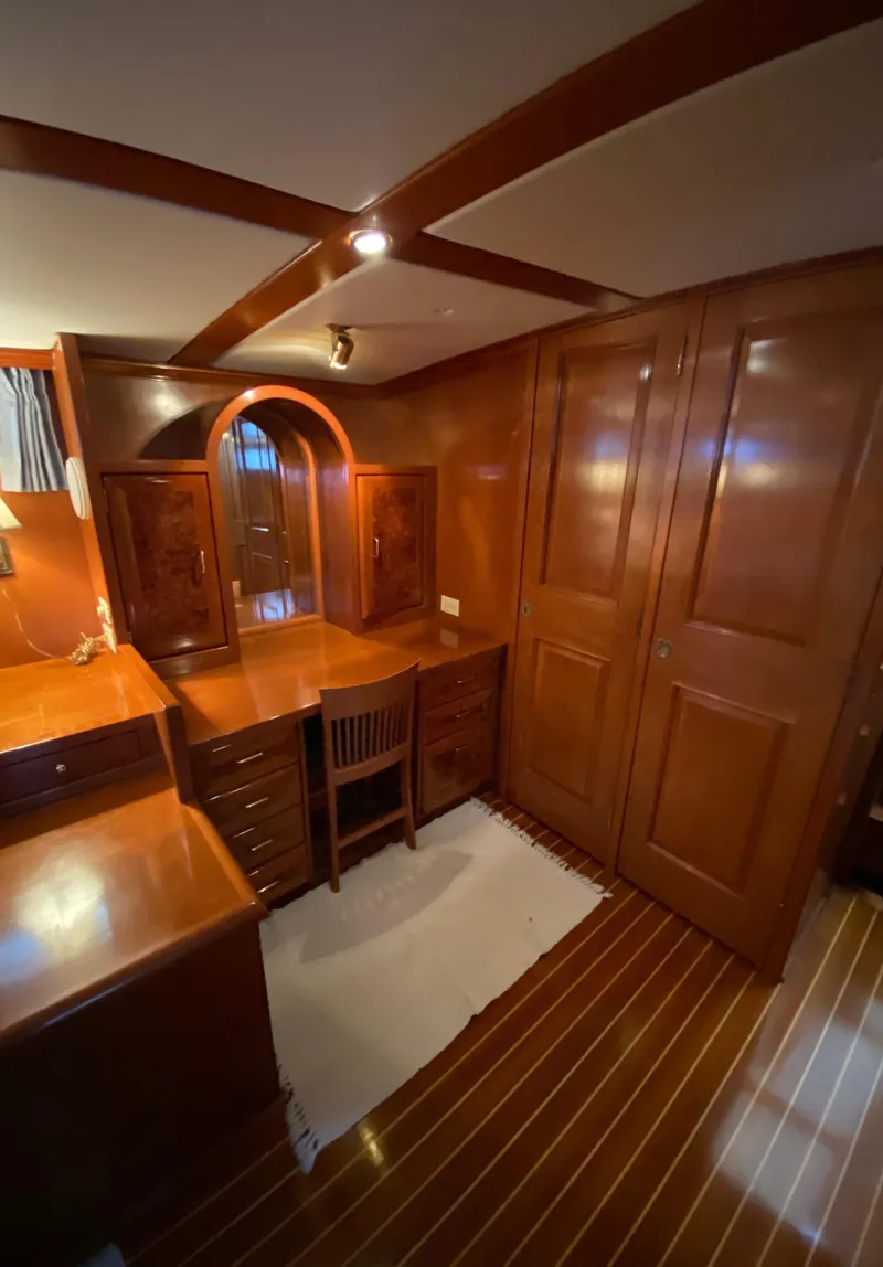 Slide: The Image of 1971 Matthews Custom Pilothouse Motor Yacht interior with wooden desk and cabinetry. - 40
