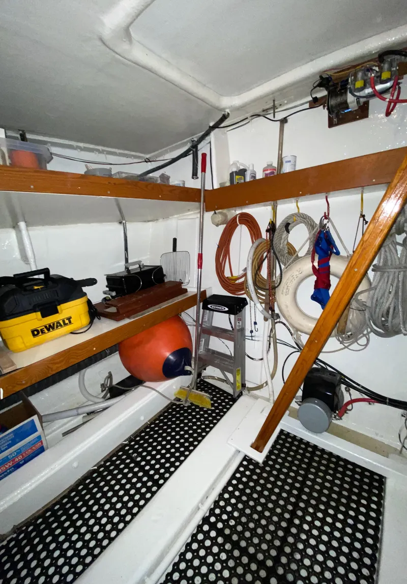 Slide: The Image of Interior of 1971 Matthews Custom Pilothouse Motor Yacht with tools and equipment storage. - 42