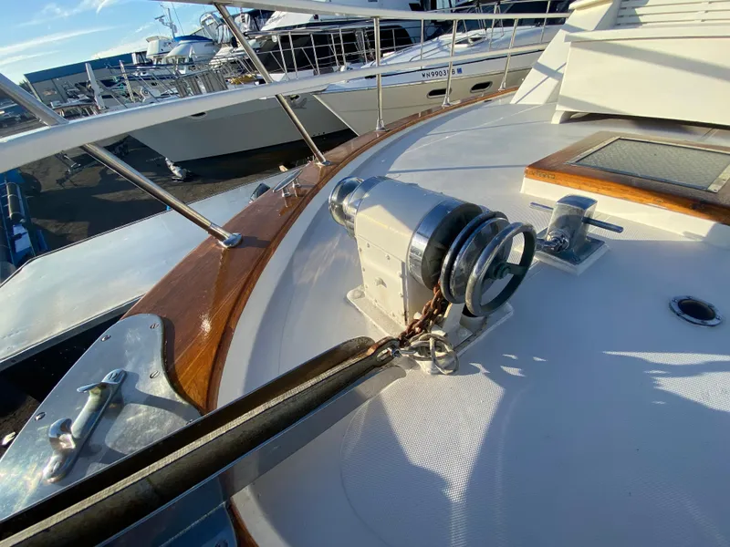 Slide: The Image of 1971 Matthews Custom Pilothouse Motor Yacht deck with winch and railing. - 7