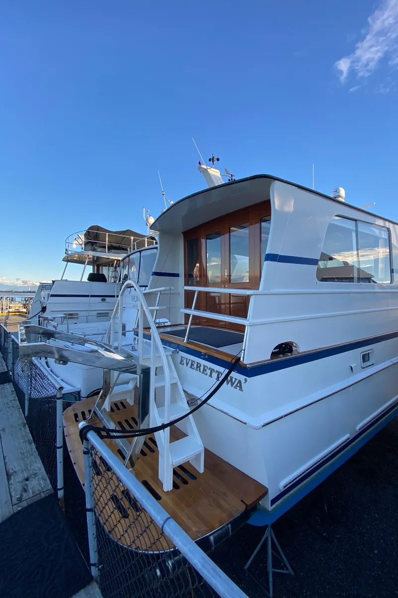 Slide: The Image of 1971 Matthews Custom Pilothouse Motor Yacht docked under clear blue sky. - 9