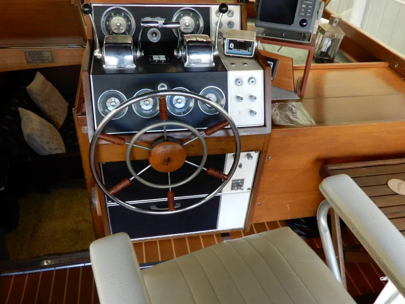 Slide: The Image of 1965 Chris-Craft 38 Constellation helm with vintage controls and wooden steering wheel. - 10