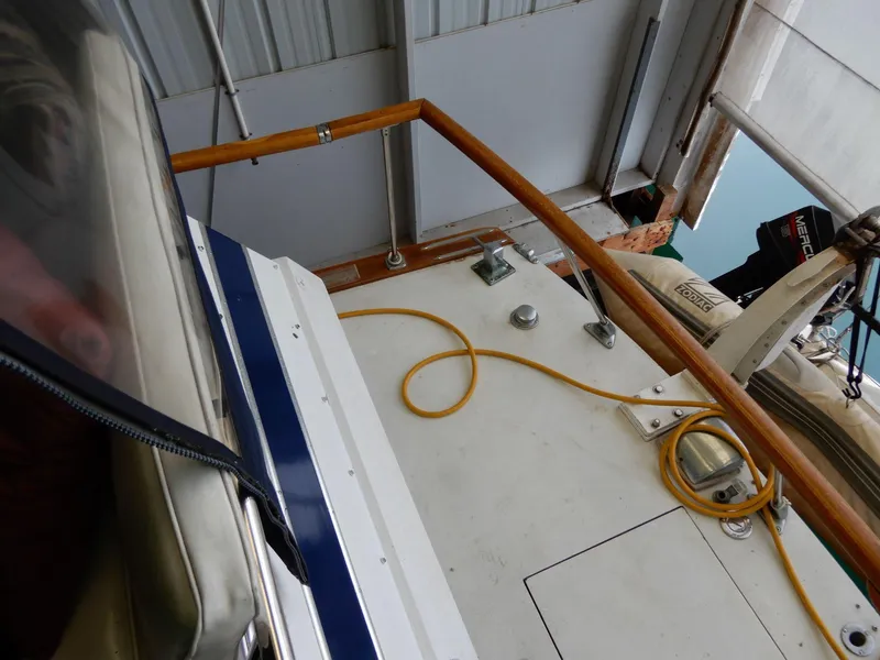 Slide: The Image of 1965 Chris-Craft 38 Constellation boat deck with railing and coiled rope. - 11