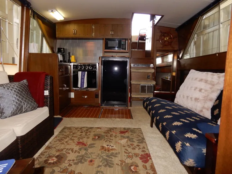 Slide: The Image of Interior of a 1965 Chris-Craft 38 Constellation boat with cozy seating and vintage decor. - 2