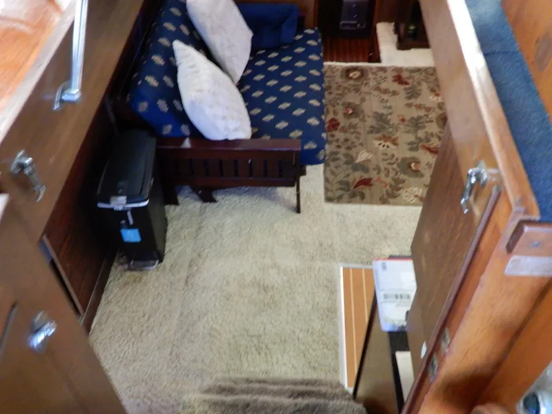 Slide: The Image of Interior of 1965 Chris-Craft 38 Constellation with cozy seating and patterned rug. - 4