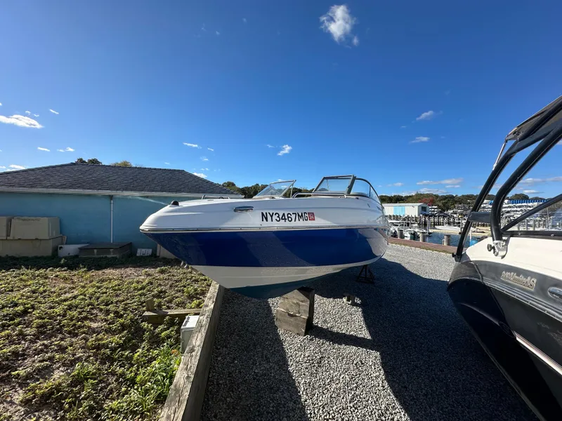 Slide: The Image of 2008 Yamaha Boats SX230 on gravel, sunny day, blue sky. - 2