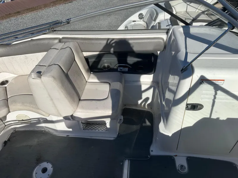 Slide: The Image of 2008 Yamaha SX230 boat interior with seating and steering area. - 7