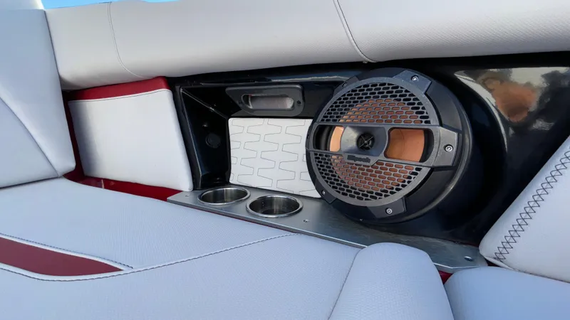 Slide: The Image of 2019 MasterCraft X24 interior with speaker and cup holders. - 33