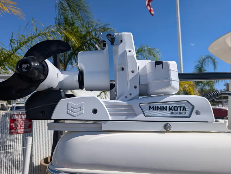 Slide: The Image of Minn Kota trolling motor on 2025 Skeeter SX 2550 Family boat, sunny day. - 11