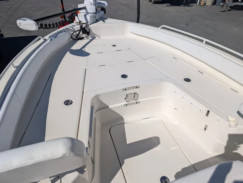 Slide: The Image of 2025 Skeeter SX 2550 Family boat deck with seating and storage compartments. - 26