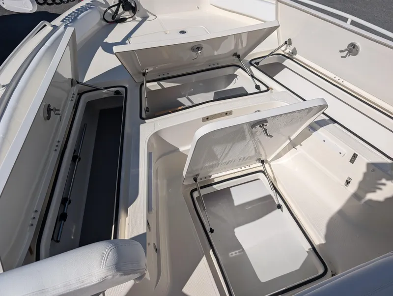Slide: The Image of 2025 Skeeter SX 2550 Family boat with open storage compartments. - 27