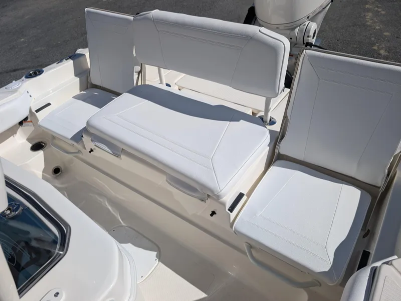 Slide: The Image of 2025 Skeeter SX 2550 Family boat seating area with white cushioned seats. - 29
