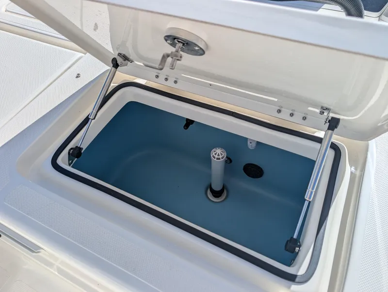 Slide: The Image of Open storage compartment on 2025 Skeeter SX 2550 Family boat. - 34