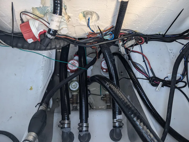 Slide: The Image of Wiring and hoses inside 2025 Skeeter SX 2550 Family boat. - 38