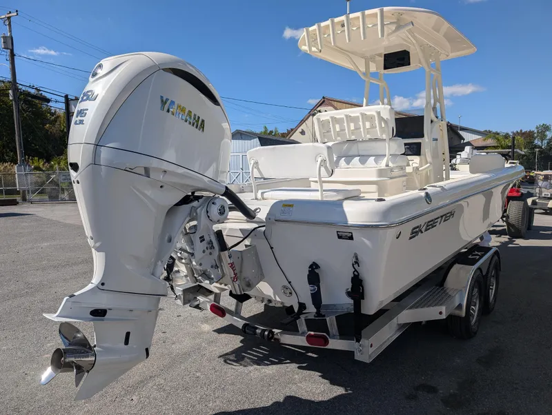 Slide: The Image of 2025 Skeeter SX 2550 Family boat with Yamaha engine on trailer. - 6