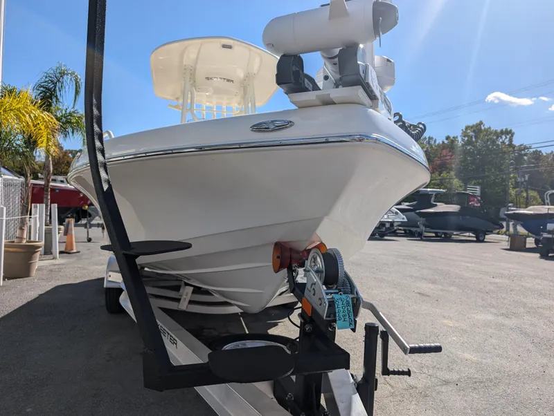 Slide: The Image of 2025 Skeeter SX 2550 Family boat on trailer, parked outdoors. - 9