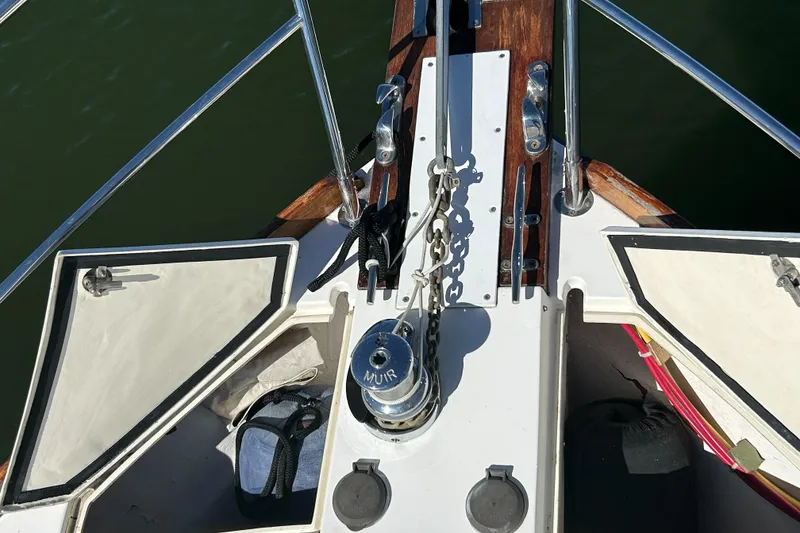 Slide: The Image of Deck view of 2005 Sabre 42 Hardtop Express with anchor chain and storage compartments. - 11