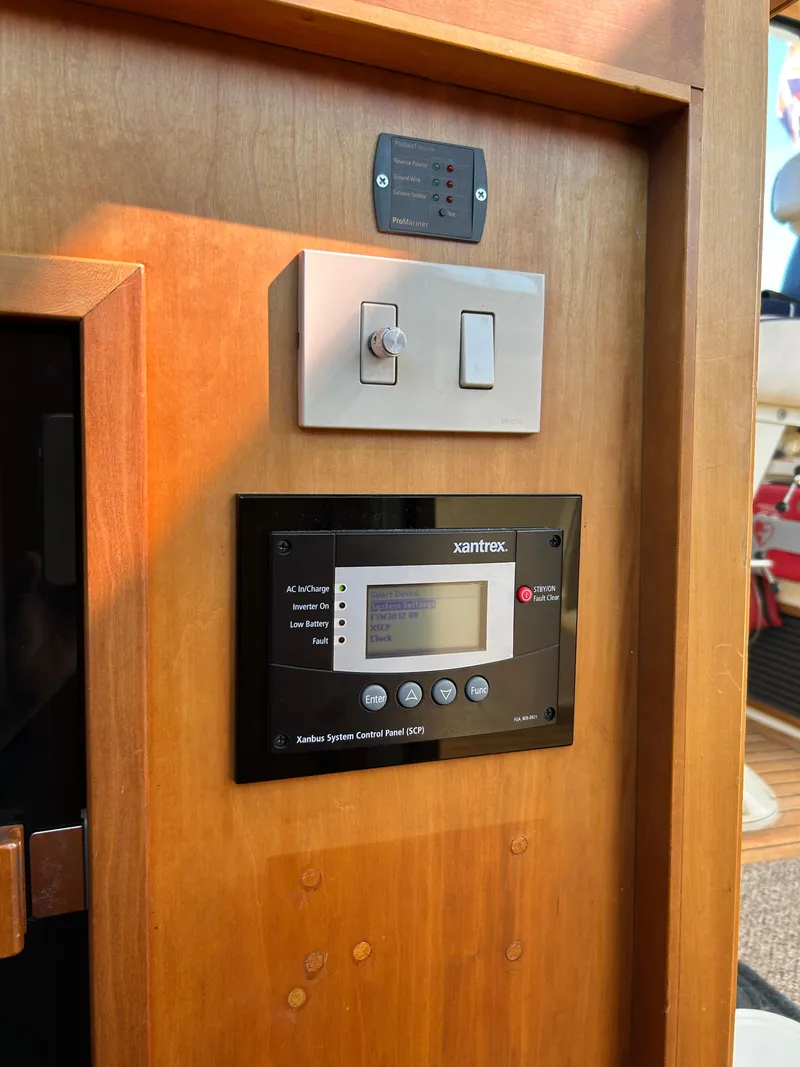 Slide: The Image of Control panel and switches on 2005 Sabre 42 Hardtop Express yacht interior. - 20