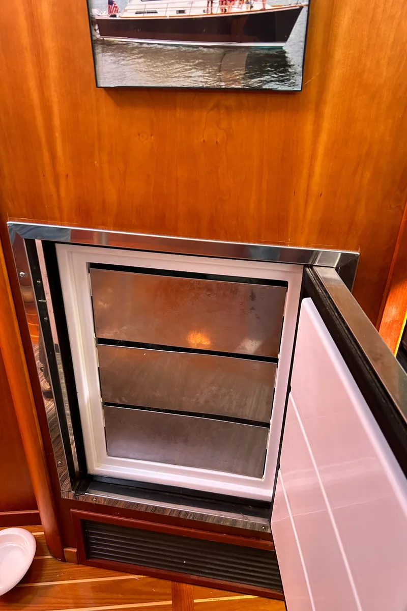 Slide: The Image of Open refrigerator on 2005 Sabre 42 Hardtop Express yacht interior. - 21
