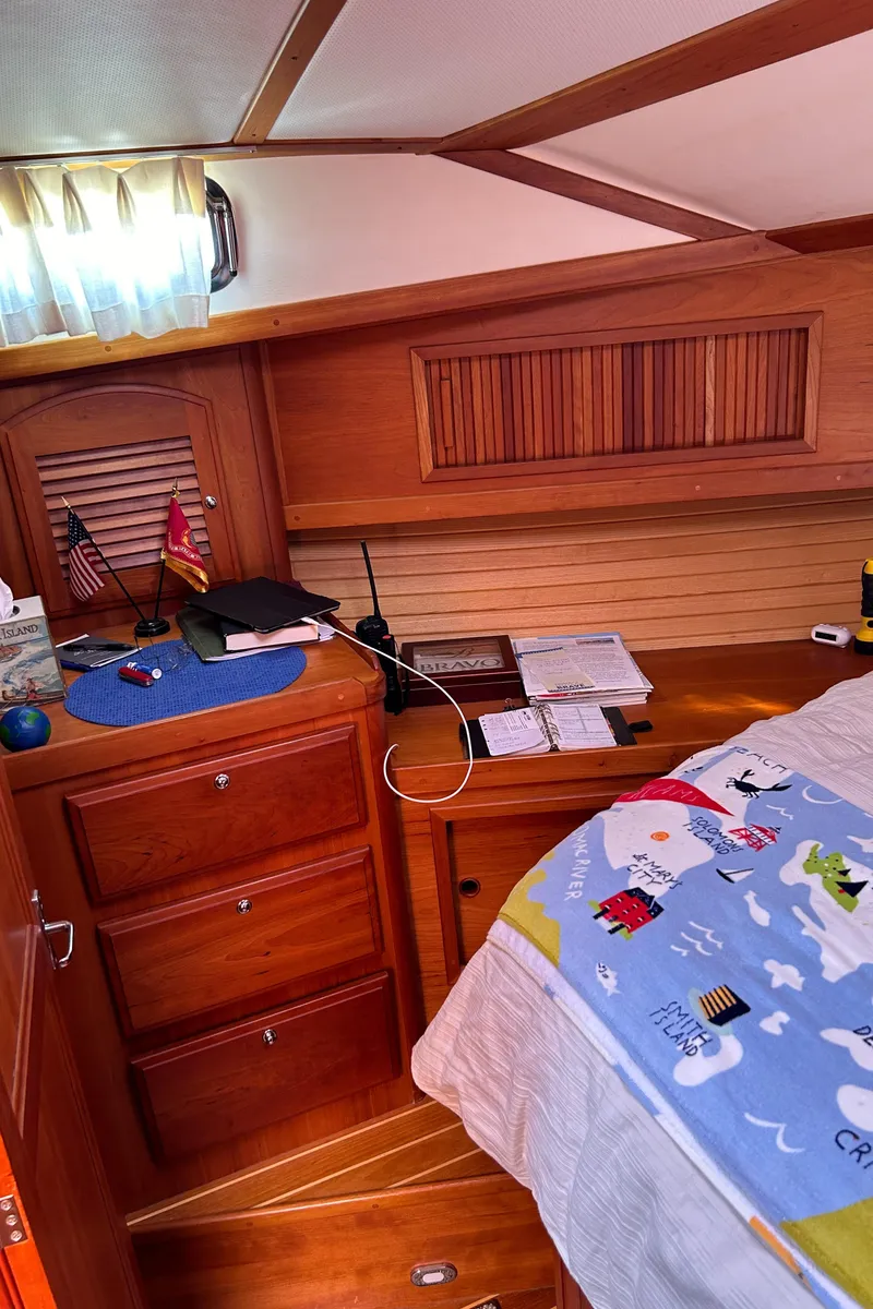Slide: The Image of Interior cabin of 2005 Sabre 42 Hardtop Express with wooden cabinetry and nautical decor. - 24