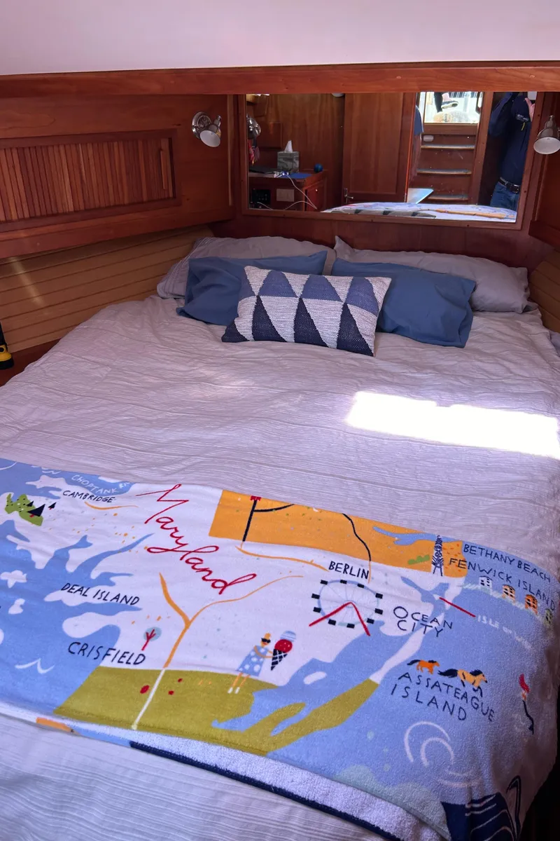 Slide: The Image of Cozy bedroom in 2005 Sabre 42 Hardtop Express yacht with nautical decor. - 28
