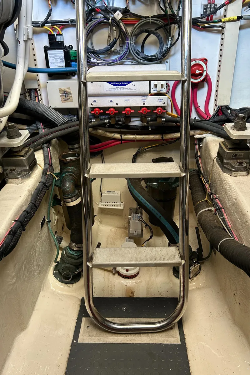 Slide: The Image of Engine room of 2005 Sabre 42 Hardtop Express with ladder and wiring. - 33